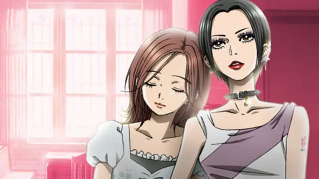 Nana Osaki and Hachi sit together with a pink bedroom in the background